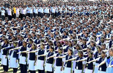 Students read out the Preamble of the Constitution on ‘International Day of Democracy’ in Mysuru on Friday. (Photo |  Udayashankar S)