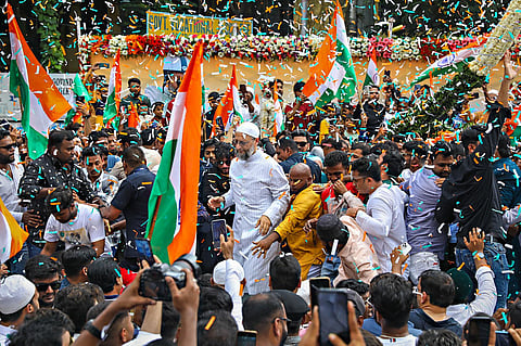 All India Majlis-e-Ittehadul Muslimeen (AIMIM) President Asaduddin Owaisi with his supporters participate in a 'Tiranga' rally on 'National Integration Day', in Hyderabad. (Photo | PTI)