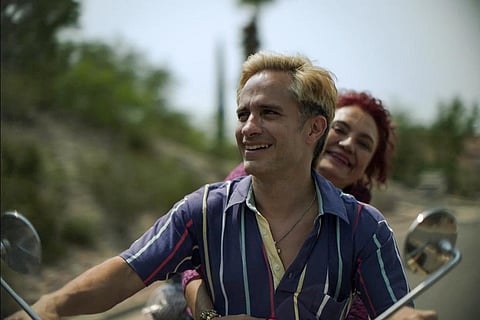 This image released by Amazon Prime Video shows Gael Garcia Bernal, foreground, and and Perla de la Rosa in a scene from 'Cassandro. (AP)