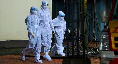 Health workers in PPE kits at a 'Nipah' virus isolation ward, at a medical college in Kozhikode.(Photo | PTI)