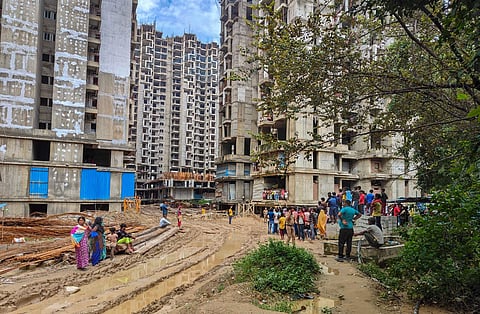 Noida: Workers at the under construction Amrapali Dream Valley society in Noida Extension, where eight people were killed in a lift crash on September 15. (PTI)