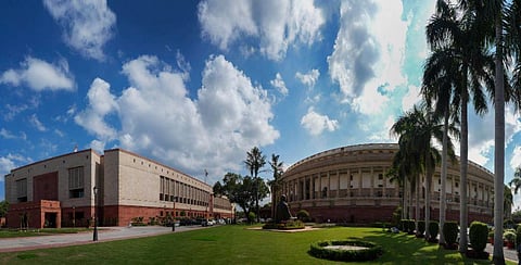A view of the existing Parliament building and the new complex (L) on the first day of the special session of Parliament, in New Delhi, Monday, Sept. 18, 2023. (Photo | PTI)
