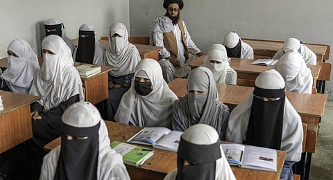 Afghan girls attend a religious school, which remained open since the last year's Taliban takeover, in Kabul, Afghanistan. (Photo | AP)