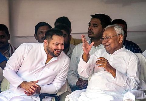 Bihar Chief Minister Nitish Kumar with Deputy Chief Minister Tejashwi Yadav during a ceremony in Patna on Monday. (Photo | PTI)