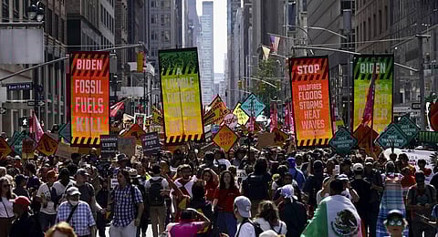 Climate activists block traffic on Park Avenue during a march protesting energy policies and the use of fossil fuels, in New York. (Photo | AP)