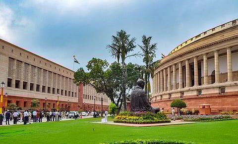 The old and new Parliament buildings on the eve of a special session, in New Delhi, Sunday, Sept. 17. (PTI)
