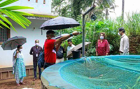 Health workers examine the residence of a Nipah virus victim and collect clinical samples, at Kuttiyadi in Kozhikode district on Sept 18, 2023. (Photo | PTI)