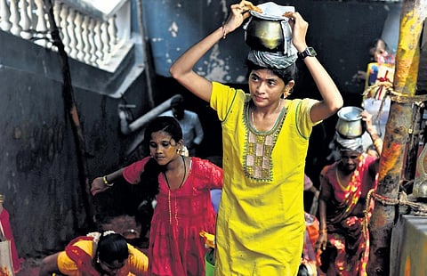 Devotees carrying offerings to Goddess Kanaka Durga on Friday as part of Sravana Masam atop Indrakeeladri Hill in Vijayawada | Prasant Madugula