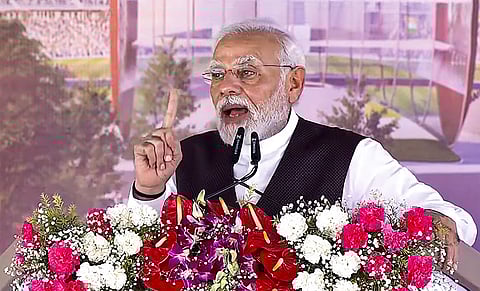 Prime Minister Narendra Modi speaks during the foundation stone laying ceremony of an international cricket stadium, in Varanasi. (Photo | PTI)