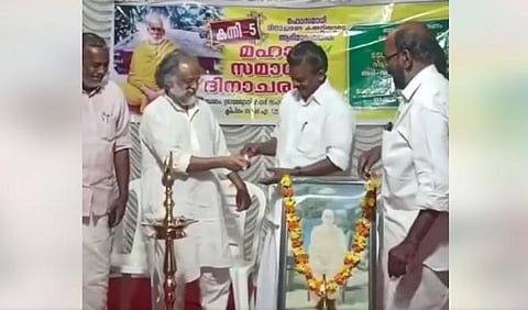 Music director Kaithapram holds the hand of Kerala Minister K Radhakrishnan (Videograb)