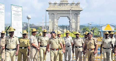 Police deployed outside KRS dam on Saturday; A dog joins the protest by carrying an empty pot in Mandya  |  Udayashankar S 