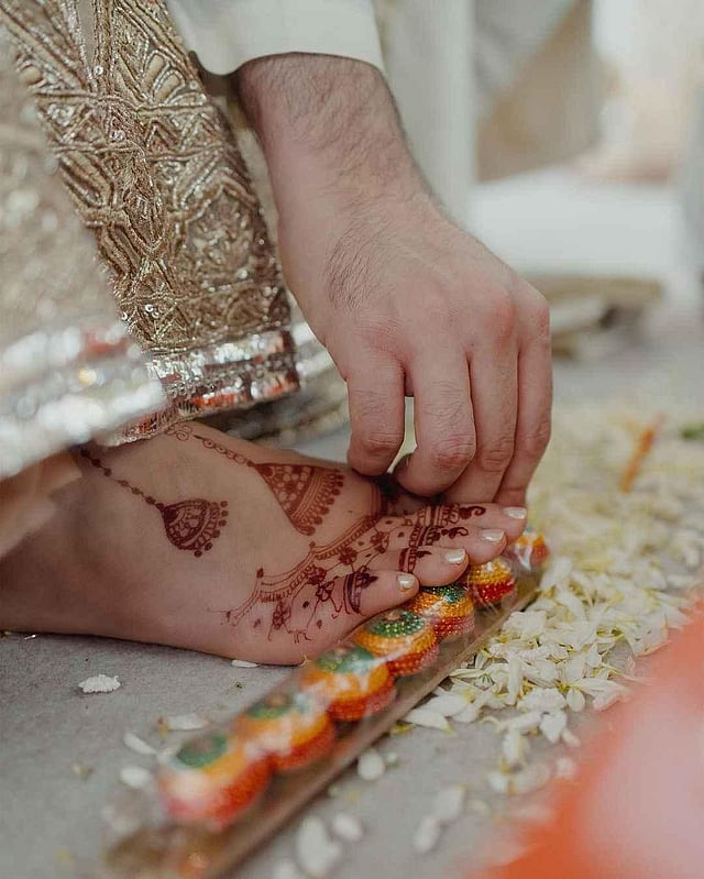 Raghav holds Parineeti's toe. (Parineeti Chopra Instagram)