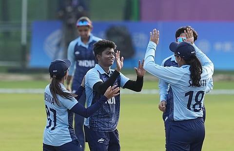 Indian bowler Pooja Vastrakar celebrates with teammates after the wicket of Sri Lankan batter Nilakshi de Silva during the women's cricket final match. (Photo | PTI)