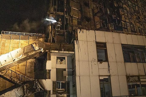 In this photo provided by the Odesa Region Administration, firefighters work to extinguish a fire in a hotel at the seaport after a Russian rocket attack in Odesa. (Photo | AP)