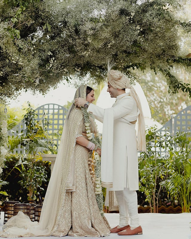 Raghav is seen putting the varmala (wedding garland) around Parineeti.  (Parineeti Chopra Instagram)