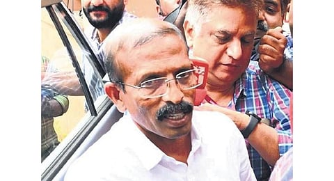 CPM leader Aravindakshan P R being brought to ED office in Kochi. (Photo | Express)