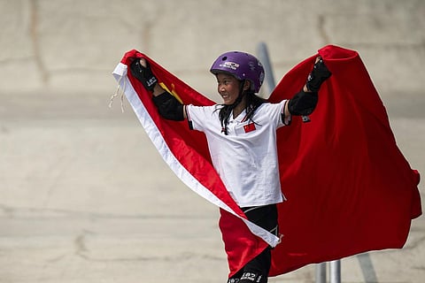China's Cui Chenxi celebrates after wining the gold medal for skateboarding women's street final at the 19th Asian Games in Hangzhou, China, Wednesday, Sept. 27, 2023. (Photo | AP)