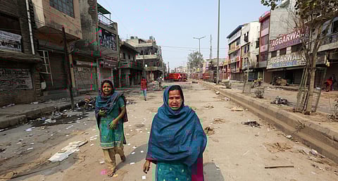 In this backdated image used for representational purposes, Muslim families leave a riot-affected area at Khajuri Khas area in New Delhi. (Photo | Shekhar Yadav, EPS)