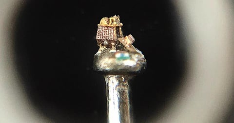 The 0.8mm-tall golden replica of the Chandrayaan-3 lander. (Photo | Express)