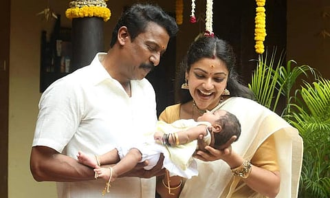 Samuthirakani and Abhirami in 'Are You Okay Baby'.