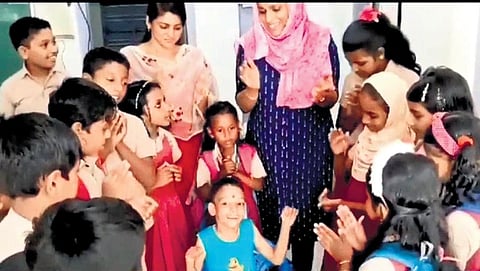 Archith (centre) with his teachers and classmates. (Photo | Express)