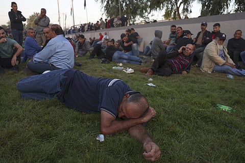 Palestinian workers gather at the Erez crossing between Israel and the northern Gaza Strip, on September 28, 2023, after the crossing was reopened by Israeli authorities. (Photo | AFP)