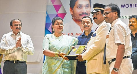 Tourism Minister RK Roja presenting ‘Best Tourist Friendly Station Award’ to Vijayawada Railway Station officials on Wednesday. (Photo | Prasant Madugula, EPS)