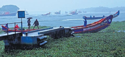 Fishermen return to the shore in Fort Kochi amid heavy rain on Friday | T P Sooraj