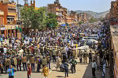 Security personnel attempt to maintain law and order after a clash between two communities, in Jaipur, Saturday, Sept. 30, 2023. (Photo | PTI)
