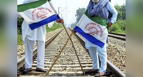 Punjab Mazdoor Sangharsh Committee activists block railway tracks during a protest demanding flood compensation, MSP guarantee law and debt relief in Amritsar, Sept. 28, 2023. (Photo | PTI)