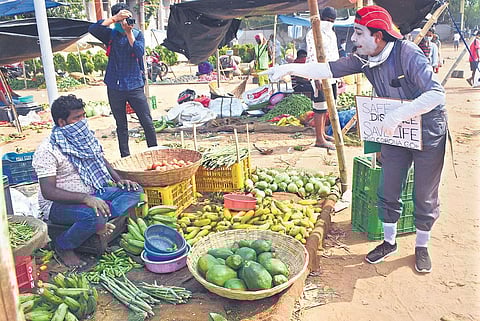 File photo - Mime artiste Chittaranjan Satpathy creating awareness on Covid-19 at Unit-I market in Bhubaneswar | Biswanath Swain