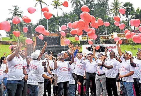 Participants of the walkathon release heart-shaped balloons as part of the World Heart Day at Kanakakunnu Palace ground on Friday | Vincent Pulickal
