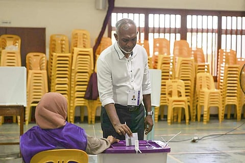 Maldives' main opposition candidate Mohamed Muiz casts his vote in Male (Photo | AP)
