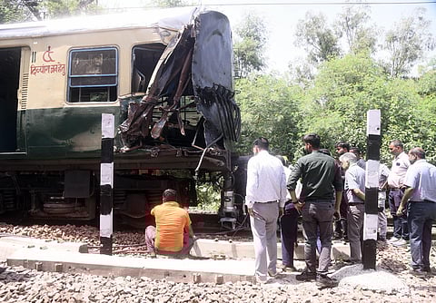 Restoration work is underway after a coach of a local EMU train derailed near Bhairon Marg, in New Delhi on Sunday. (Photo | Parveen Negi)
