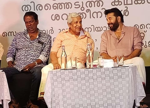 Actors Mammootty and Salim Kumar sharing stage with Professor  C R Omanakuttan.