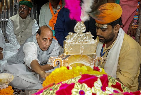Defence Minister Rajnath Singh offers prayers at the Ramdevra Temple near Pokhran, Monday, Sept. 4, 2023. (PTI)