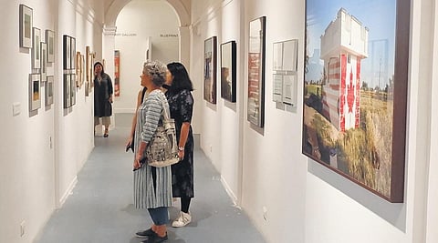 Attendees looking at the works on display at DCAW, Bikaner House
