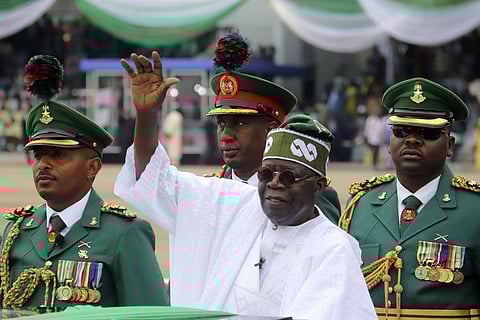 Nigeria's new President Bola Ahmed Tinubu inspects honour guards after taking an oath of office at a ceremony in Abuja, Nigeria on May 29, 2023. (Photo | AP)
