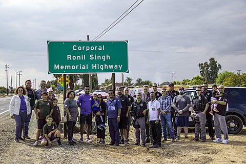Signage proclaiming the 'Corporal Ronil Singh Memorial Highway' stands at Highway 33 and Stuhr Road. (Assemblyman Juan Alanis Twitter)