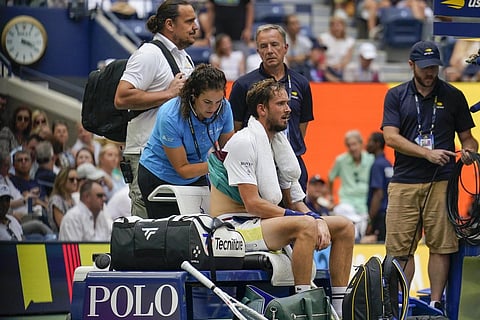 Daniil Medvedev, of Russia, is attended to by a trainer during a break in play against Andrey Rublev, during the quarterfinals of the US Open tennis championships, Sept 6, 2023. (Photo | AP)