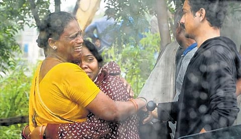 Family members of the 55-year-old missing woman Lakshmi shed tears after her body was found at Moosarambagh Bridge on Wednesday |Sri Loganathan Velmurugan