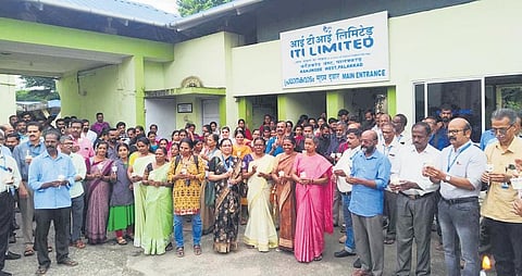 The employees of the ITI Limited lighting candles in front of the factory at Kanjikode in Palakkad to protest the non-payment of salaries