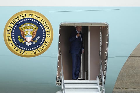 US President Joe Biden gestures as he boards Air Force One at Andrews Air Force Base, on Sept. 7, 2023, for a trip to attend the G20 summit in New Delhi. (Photo | AP)