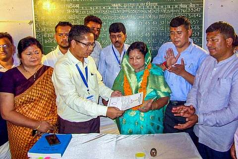 BJP candidate Parvati Das receives her certificate of election after winning the Bageshwar Assembly constituency by-election, in Bageshwar, Friday, Sept. 8, 2023. (PTI Photo)