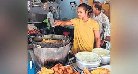 Chandu Nayak is preparing snacks at Stephen’s teashop near Statue Junction in Fort Kochi