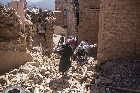 Residents flee their homes after an earthquake in Moulay Brahim village, near the epi centre of the earthquake, outside Marrakech, Morocco. (Photo | AP)