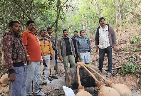 SEB sleuths destroying large quantity of jaggery wash during a raid in western parts of Prakasam district | Express