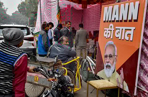 A specially-abled person listens to PM Narendra Modi's 108th episode of Mann Ki Baat, at Mata Sundri road, in New Delhi | ANI