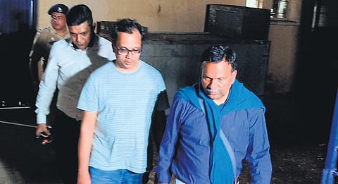 Venkat Raman, father of the murdered boy, arrives at the Government Hospital mortuary at Hiriyur on Tuesday | Express