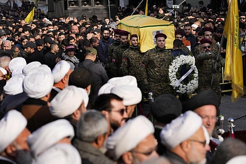 Hezbollah fighters carry the coffin of their commander Wissam al-Tawil during his funeral procession in the village of Khirbet Selm, south Lebanon, Tuesday, Jan. 9, 2024. (Photo | AP)